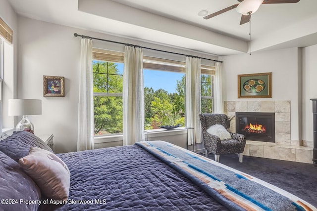 64 White Peaks Ln, Glenwood Springs, CO 81601 - bedroom with a tiled fireplace and ceiling fan