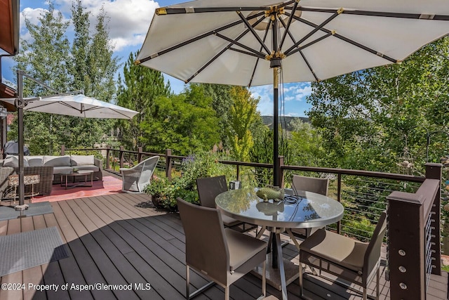 64 White Peaks Ln, Glenwood Springs, CO 81601 - wooden terrace with outdoor dining space and an outdoor hangout area