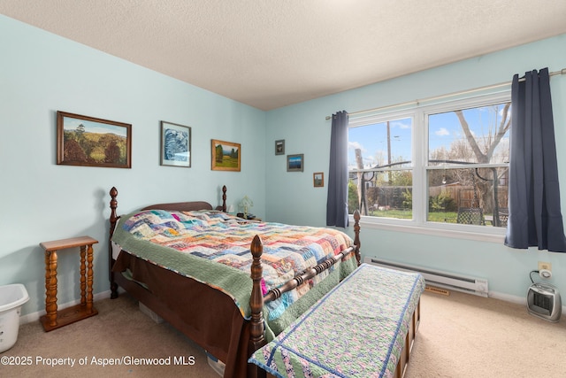 bedroom featuring baseboard heating, carpet floors, a textured ceiling, and baseboards