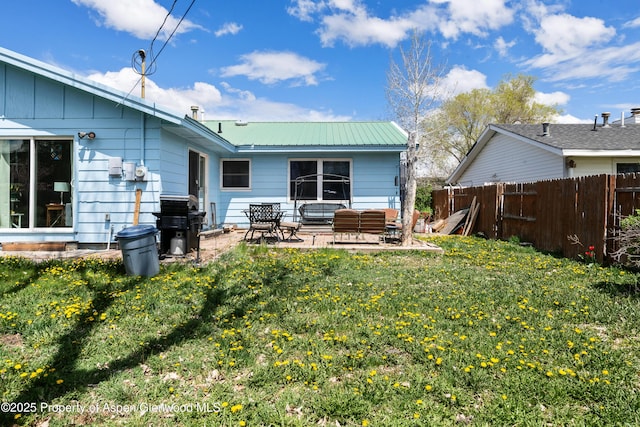 rear view of house featuring a patio