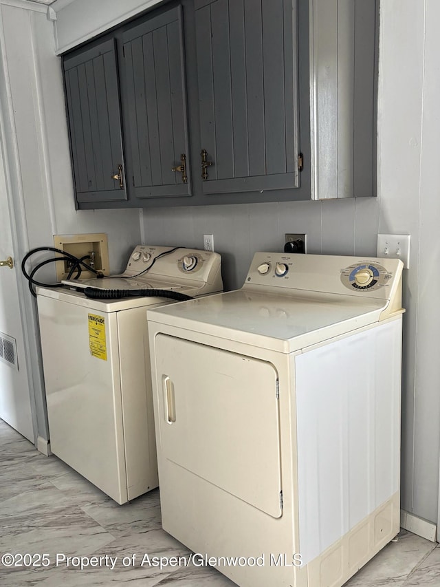 22 W Silver Bell Pl, Parachute, CO 81635 - clothes washing area featuring marble finish floor, cabinet space, and washing machine and dryer