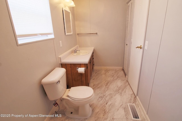 22 W Silver Bell Pl, Parachute, CO 81635 - bathroom featuring toilet, baseboards, visible vents, and vanity