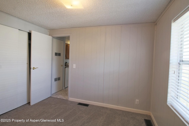 22 W Silver Bell Pl, Parachute, CO 81635 - empty room with light carpet, a textured ceiling, and visible vents