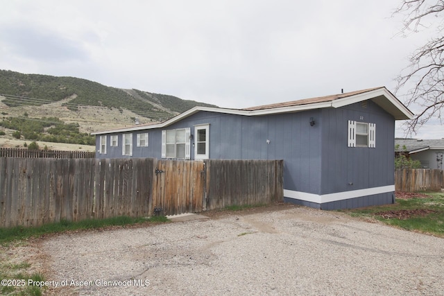 22 W Silver Bell Pl, Parachute, CO 81635 - view of side of property with fence and a mountain view