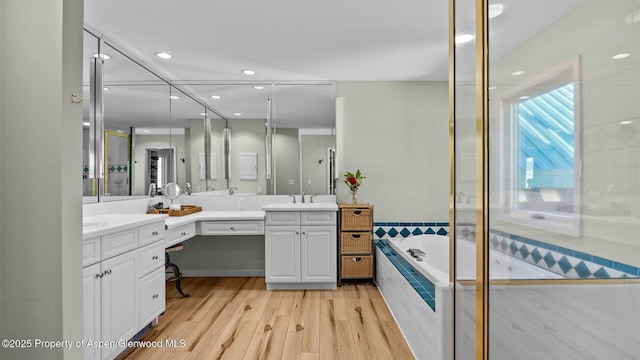 3 Red Wing Ln, Carbondale, CO 81623 - full bath with a bath, wood finished floors, vanity, and recessed lighting