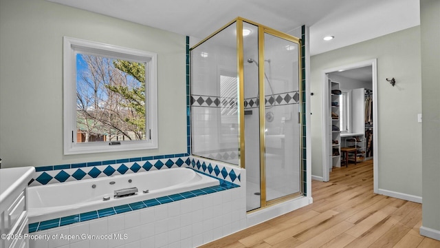 3 Red Wing Ln, Carbondale, CO 81623 - bathroom featuring a stall shower, baseboards, a bath, and wood finished floors