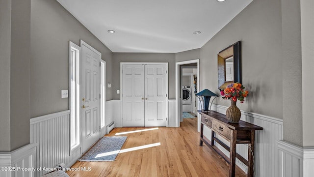 3 Red Wing Ln, Carbondale, CO 81623 - entryway with washer / dryer, a baseboard heating unit, light wood-type flooring, recessed lighting, and wainscoting