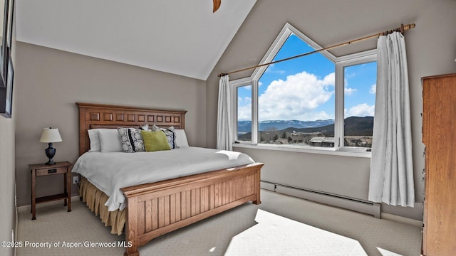3 Red Wing Ln, Carbondale, CO 81623 - bedroom with carpet flooring, a baseboard radiator, a mountain view, and vaulted ceiling