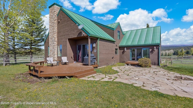 3 Red Wing Ln, Carbondale, CO 81623 - back of house featuring a yard, a chimney, fence, and a wooden deck