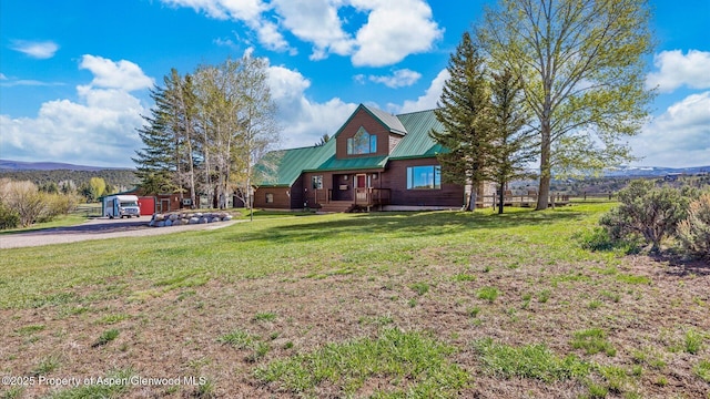3 Red Wing Ln, Carbondale, CO 81623 - view of front of house with a front lawn, a mountain view, and metal roof
