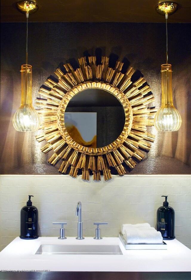 411 S Monarch St Unit H8, Aspen, CO 81611 - bathroom view of a sink and decorative backsplash