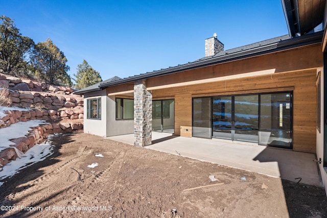 rear view of house with a patio