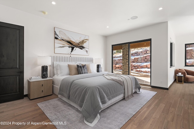 bedroom with wood-type flooring