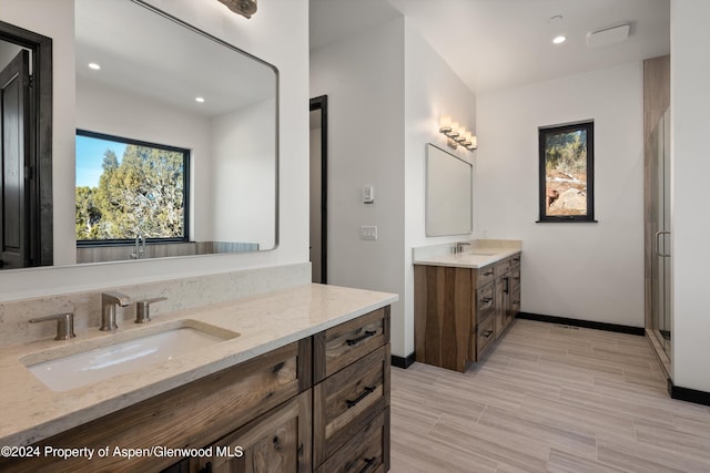 bathroom with vanity and walk in shower