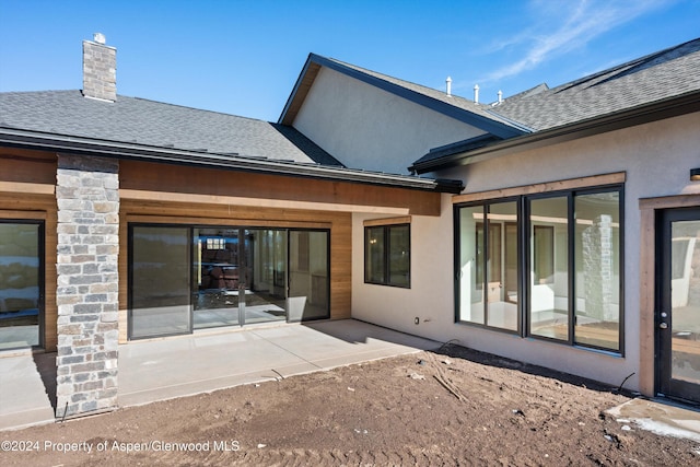 rear view of house with a patio