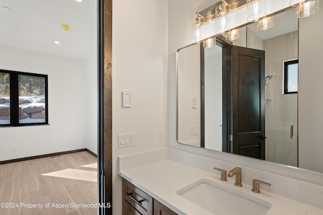 bathroom featuring vanity and hardwood / wood-style flooring