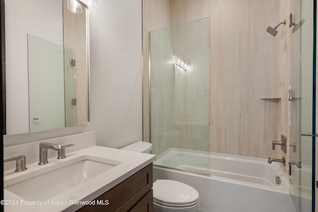 full bathroom featuring vanity, toilet, and bathing tub / shower combination