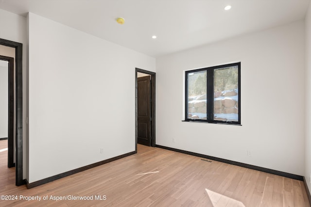 empty room featuring light hardwood / wood-style floors