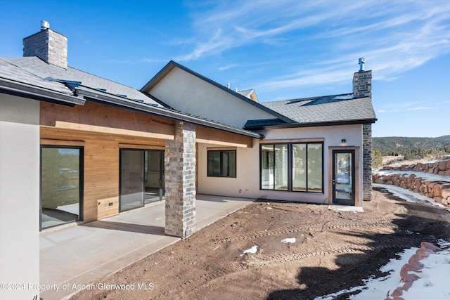 back of house with a patio