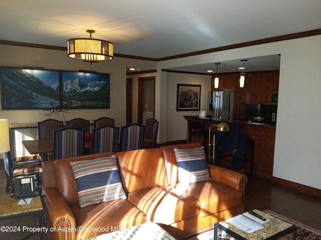 living room featuring dark hardwood / wood-style floors and ornamental molding