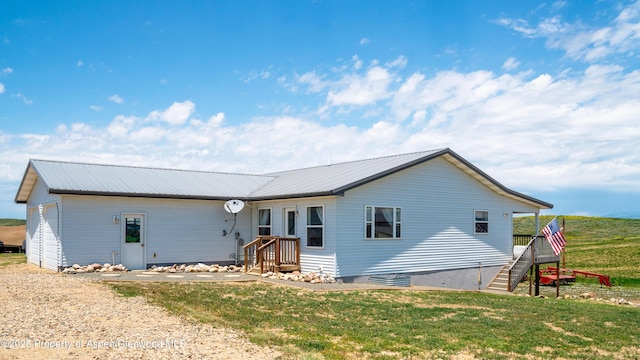 1300 Johnson Way, Craig, CO 81625 - view of front of property with a metal roof, a front lawn, and stairs