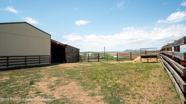 1300 Johnson Way, Craig, CO 81625 - view of yard with an outdoor structure, an exterior structure, a pole building, a mountain view, and a rural view