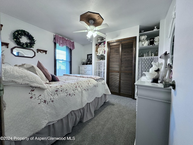 carpeted bedroom featuring ceiling fan and a closet