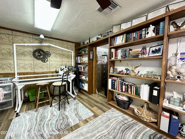 office space with hardwood / wood-style floors and a textured ceiling