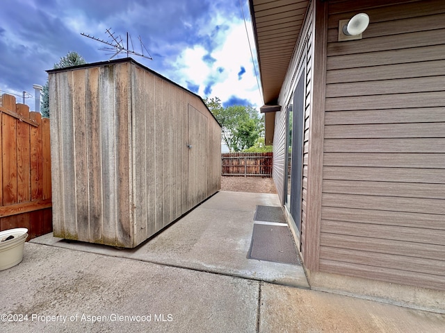 exterior space with a storage shed