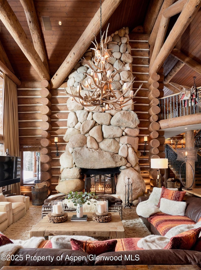 6855 Capitol Creek Rd, Snowmass, CO 81654 - living room with wooden ceiling, rustic walls, a stone fireplace, and a chandelier