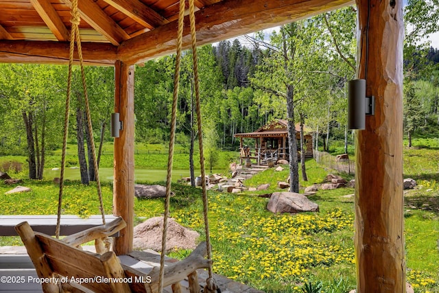 6855 Capitol Creek Rd, Snowmass, CO 81654 - view of grassy yard featuring a gazebo and a wooded view