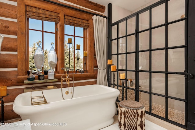6855 Capitol Creek Rd, Snowmass, CO 81654 - bathroom featuring a freestanding tub and log walls
