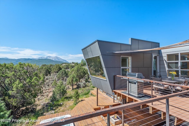 view of side of home featuring a mountain view