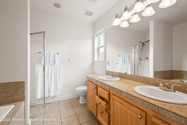 121 Ranch Creek Ln, Carbondale, CO 81623 - bathroom featuring a stall shower, a garden tub, double vanity, toilet, and tile patterned floors