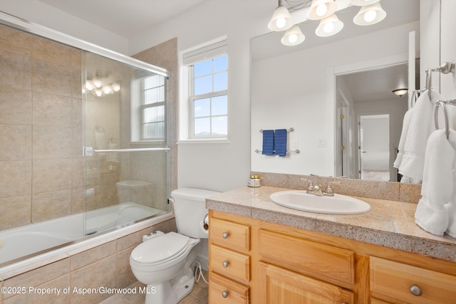 121 Ranch Creek Ln, Carbondale, CO 81623 - full bathroom with tiled shower / bath combo, vanity, and toilet