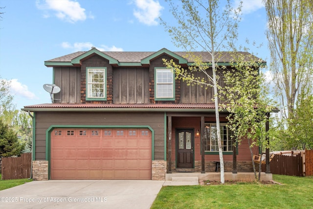 121 Ranch Creek Ln, Carbondale, CO 81623 - view of front of house featuring driveway, a garage, board and batten siding, stone siding, and a porch