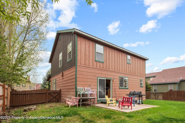 121 Ranch Creek Ln, Carbondale, CO 81623 - back of house with board and batten siding and a patio area