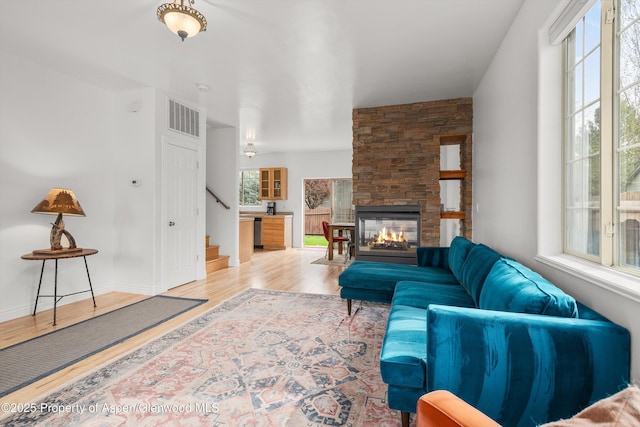 121 Ranch Creek Ln, Carbondale, CO 81623 - living room featuring wood finished floors, stairway, and a fireplace