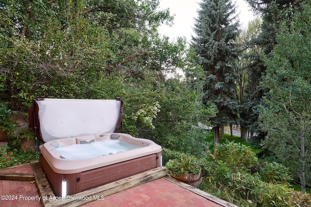 view of patio / terrace with a covered hot tub