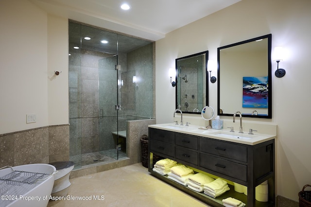 bathroom featuring tile patterned floors, vanity, and independent shower and bath