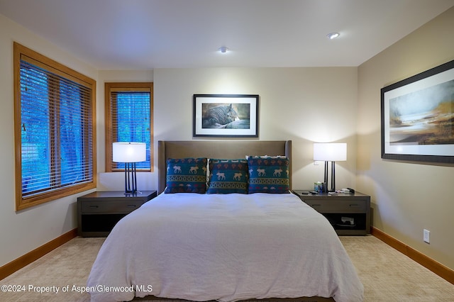 bedroom with light carpet