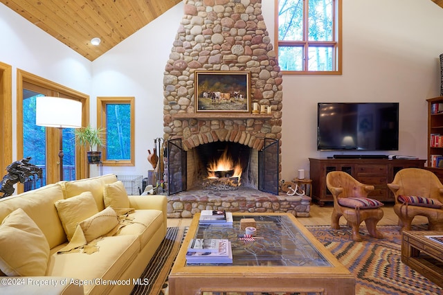 living room featuring a stone fireplace, wooden ceiling, and high vaulted ceiling