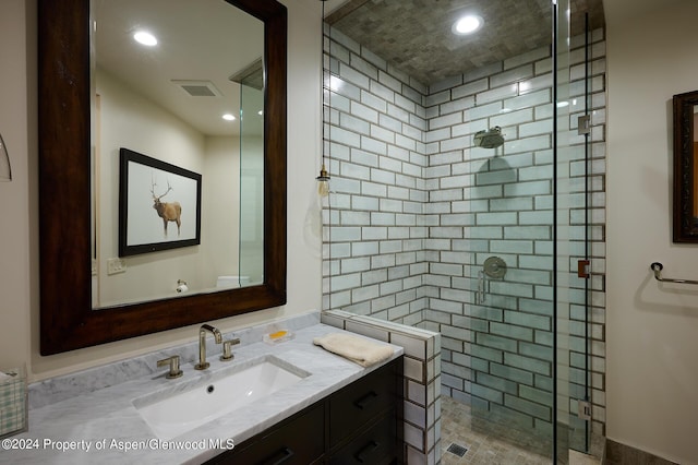 bathroom featuring vanity and walk in shower