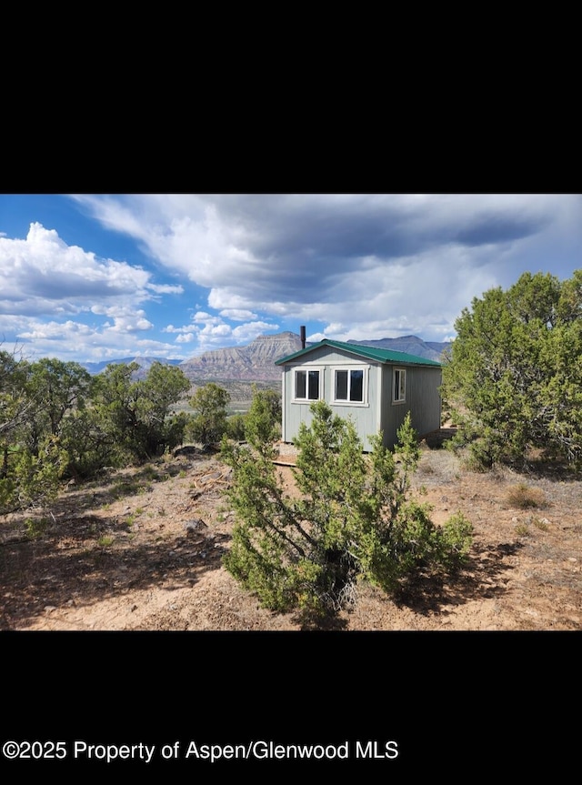 4472 V 5/10 Rd, De Beque, CO 81630 - view of home's exterior with an outdoor structure