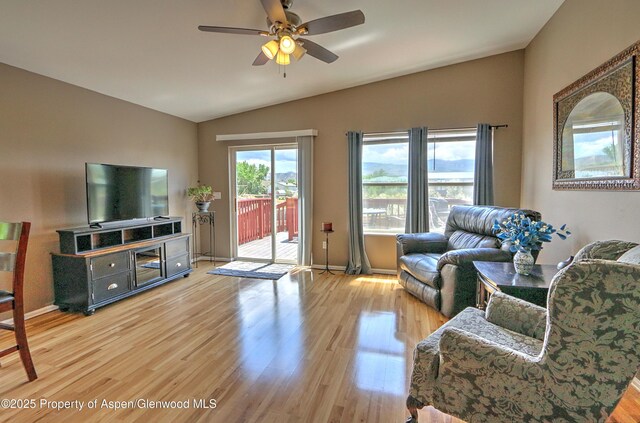 222 Creek Ct, Rifle, CO 81650 - living area with lofted ceiling, light wood finished floors, and ceiling fan