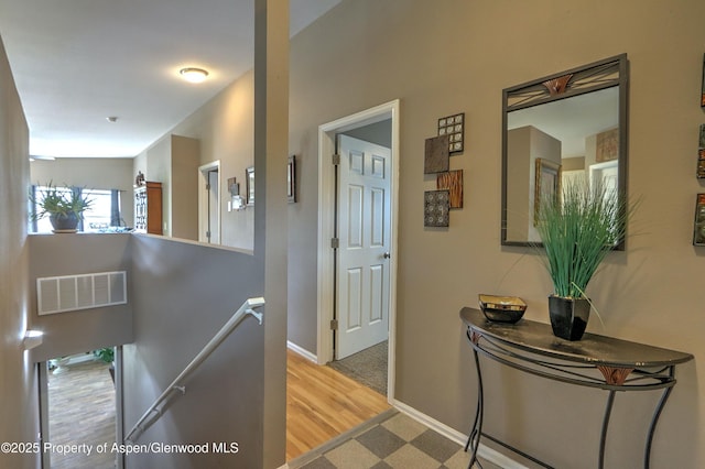 222 Creek Ct, Rifle, CO 81650 - hallway with an upstairs landing and wood finished floors