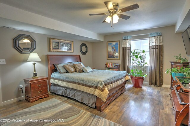 222 Creek Ct, Rifle, CO 81650 - bedroom featuring wood finished floors and ceiling fan
