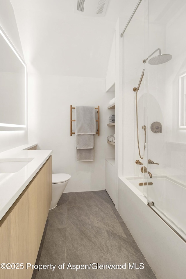 211 W Main St, Aspen, CO 81611 - bathroom featuring shower / tub combination, vanity, and toilet