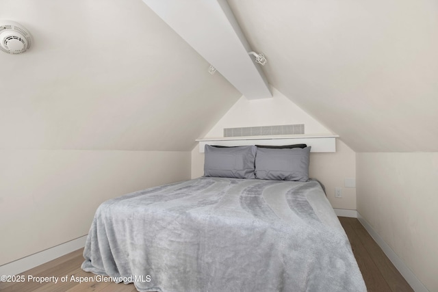 211 W Main St, Aspen, CO 81611 - bedroom featuring wood finished floors and baseboards