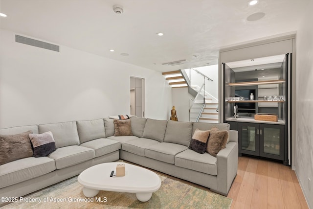 211 W Main St, Aspen, CO 81611 - living area with wood finished floors, stairs, and recessed lighting